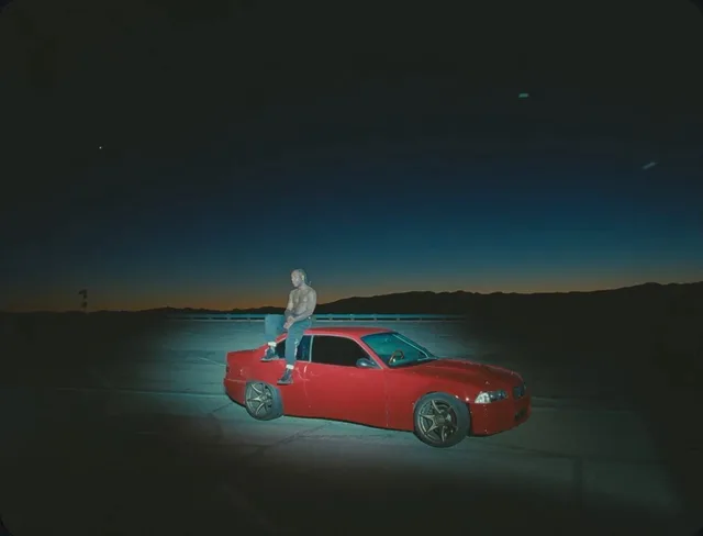 Curated visual reference, landscape image with black, blue, and red tones